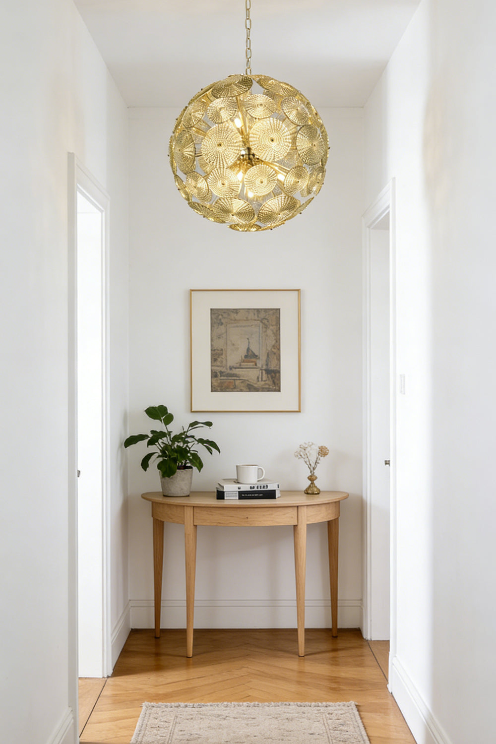 Lit modern classic spheres chandelier | Metal, Glass | Installed at the end of a corridor over a console table | Samu Lighting