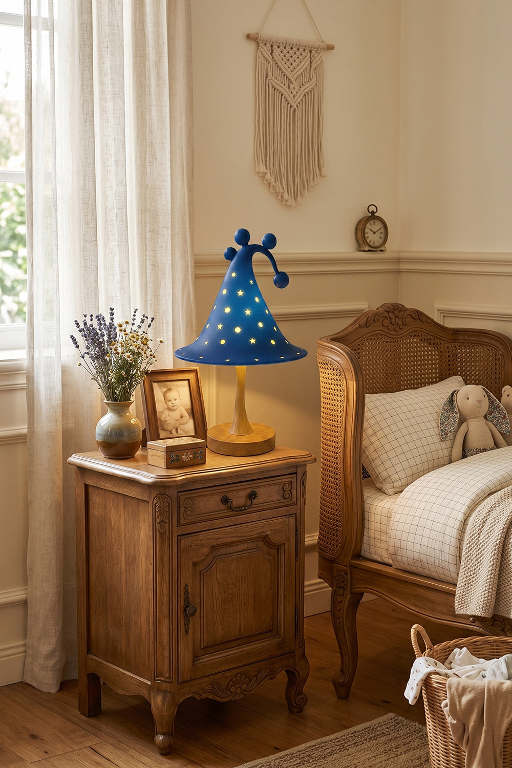 Sylvan Astral Resin Table Lamp | Blue star pattern shade | Lit bedroom setting | Rustic nightstand | Cozy interior | Samu Lamp