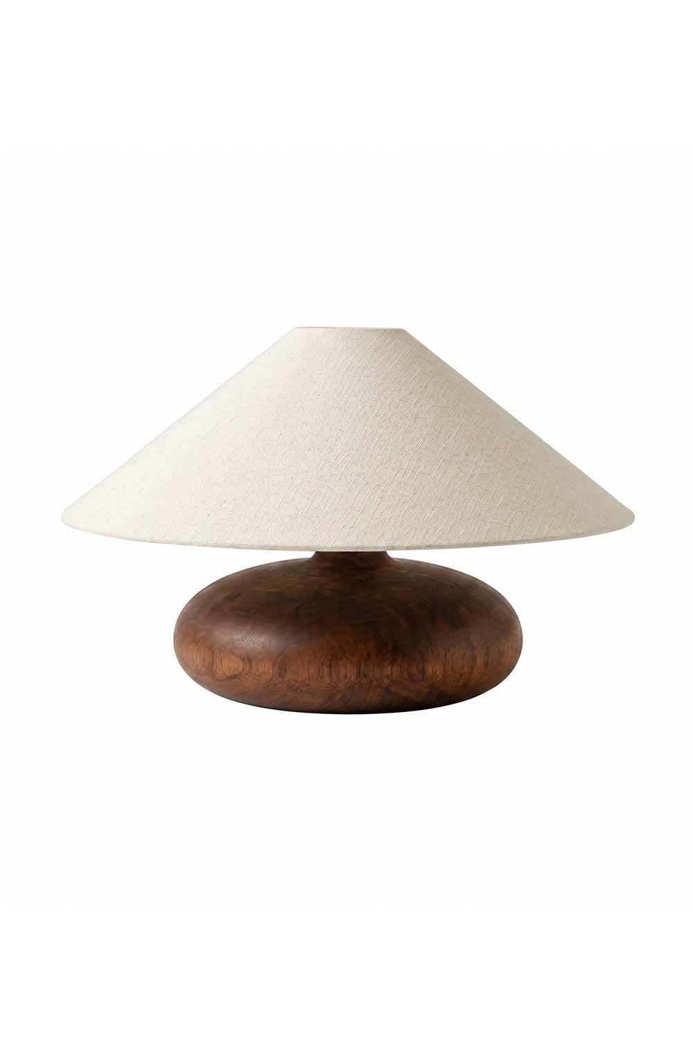 Sylvan Oval Walnut Table Lamp | Wood, Fabric, Metal | Low-profile table lamp with a wide conical beige fabric shade and a smooth oval walnut wood base | Isolated lit product shot on white background | Samu Lamp