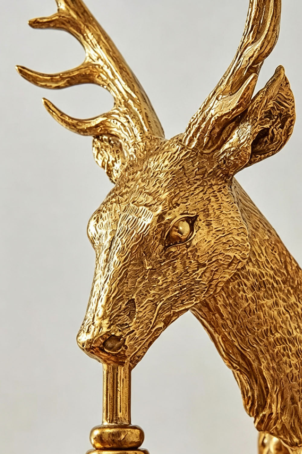 Sylvestre Cast Brass Stag Wall Sconce | Cast Brass and Crystal | Close-up detail highlighting the textured cast brass stag head and antlers | Samu Lamp