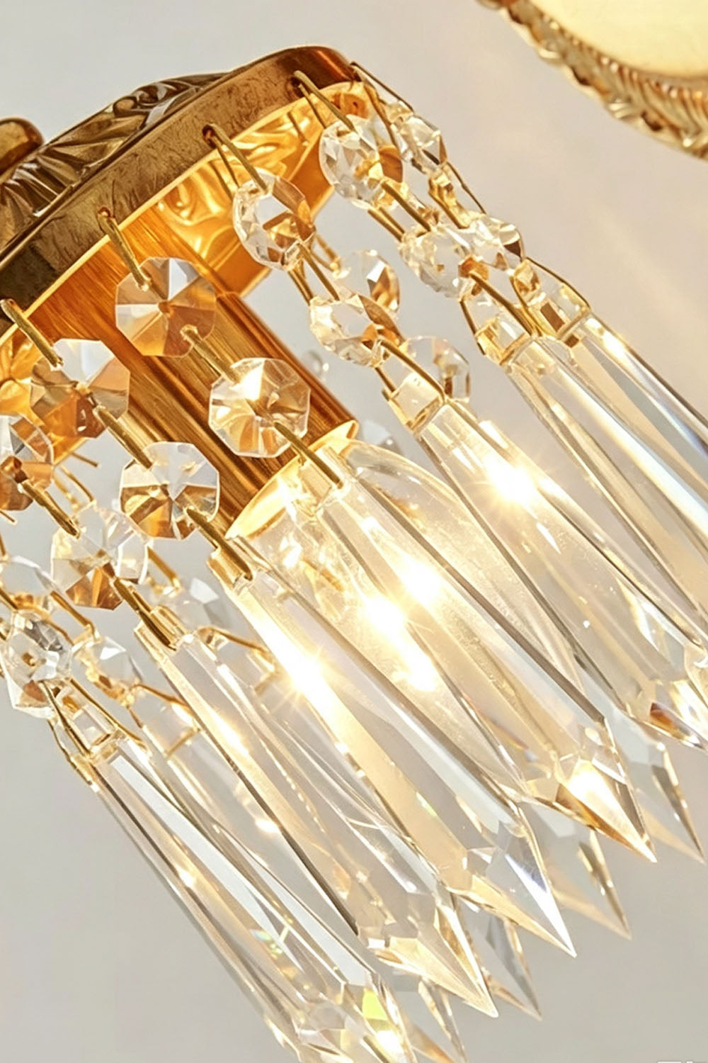 Sylvestre Cast Brass Stag Wall Sconce featuring elegant crystal accents and warm lighting.