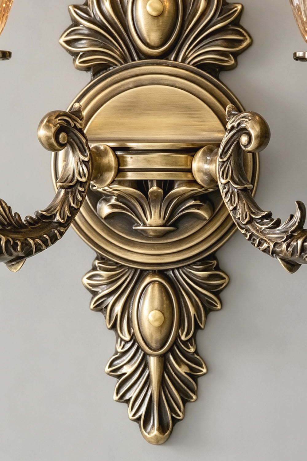 Detail view of the ornate design of the Sylvestre Petal Glass Brass Wall Lamp featuring a vintage brass finish.