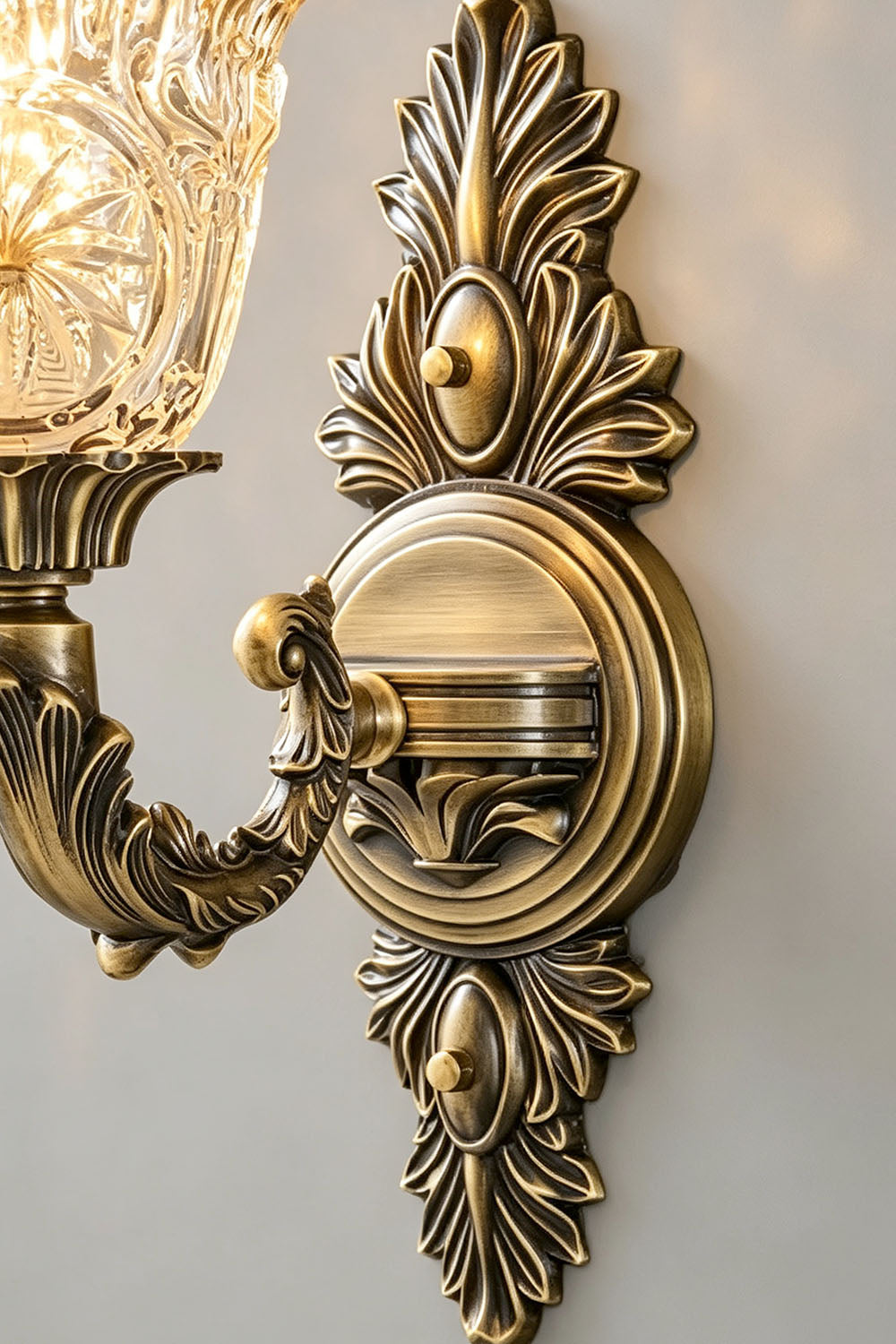 Sylvestre Petal Glass Brass Wall Lamp featuring intricate floral design and detailed finish.