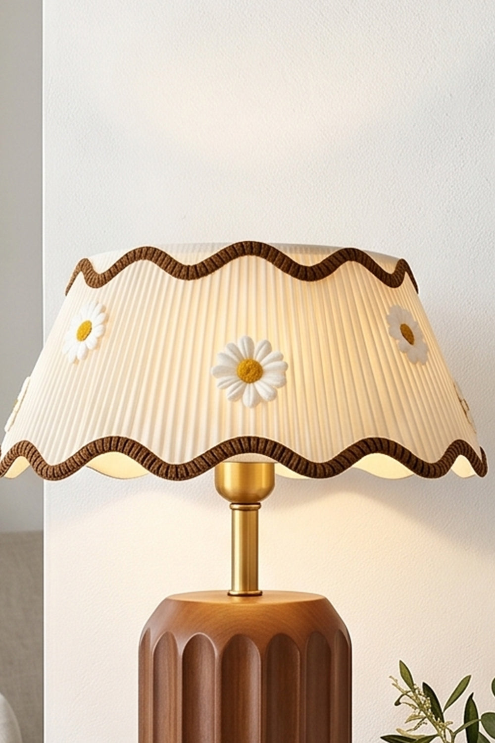 Tallulah Ribbed Wood Table Lamp | Wood, Fabric, Brass | Medium close-up showing the wavy edge of the fabric lampshade against a soft-lit contemporary interior | Samu Lamp