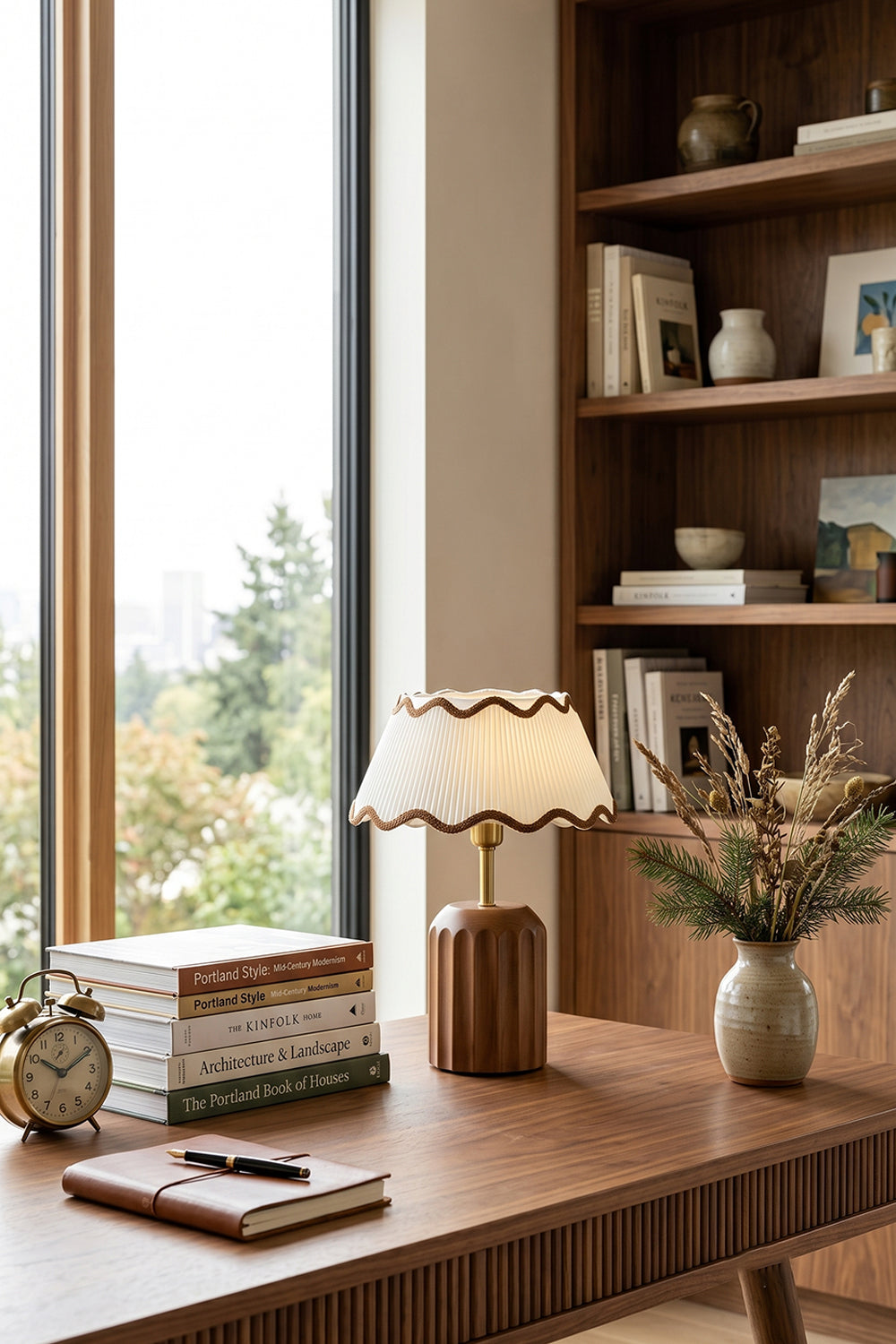 Tallulah Ribbed Wood Table Lamp | Wood, Fabric, Brass | Placed on a warm wooden home office desk next to stacked books and a vase with botanical stems | Samu Lamp