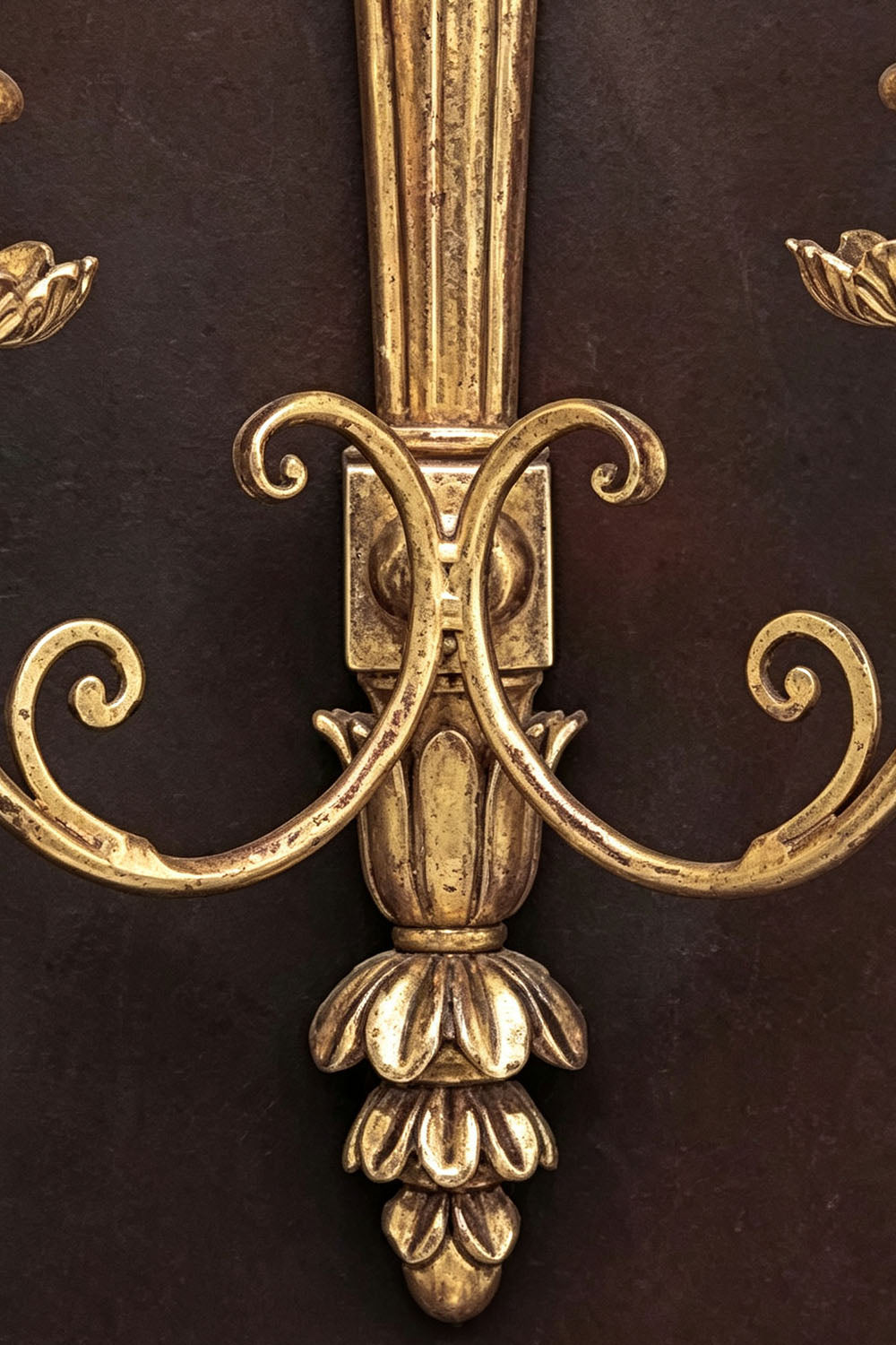 Tamsin Carved Plume Candle Wall Lamp | Carved Resin and Brass | Macro detail showing the lower scrollwork and acorn finial bottom | Samu Lamp