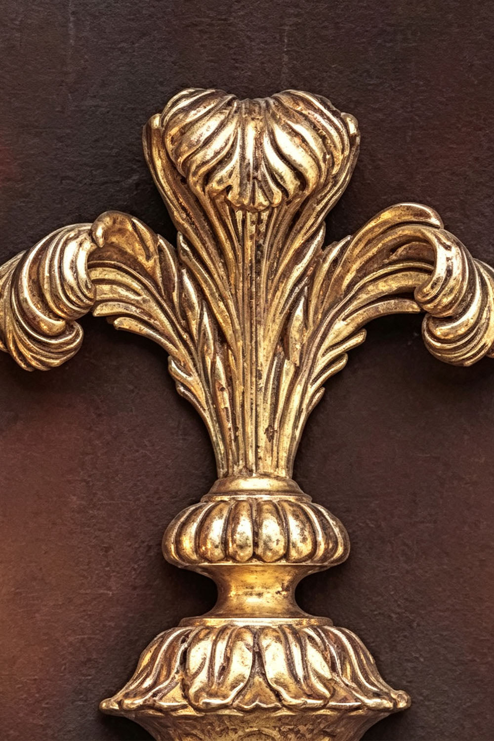 Tamsin Carved Plume Candle Wall Lamp | Carved Resin and Brass | Macro close-up showing the intricate carved plume ornament at the top | Samu Lamp