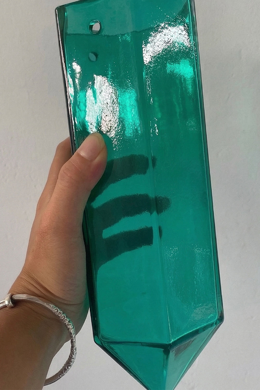 Individual teal glass prism detail | Glass | Handheld view showing material transparency and scale | Samu Lamp