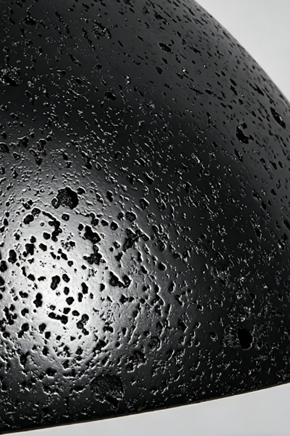 Tectonic Vein Travertine Detail | Black Travertine | Close-up of porous stone texture and rough veining | Samu Lamp