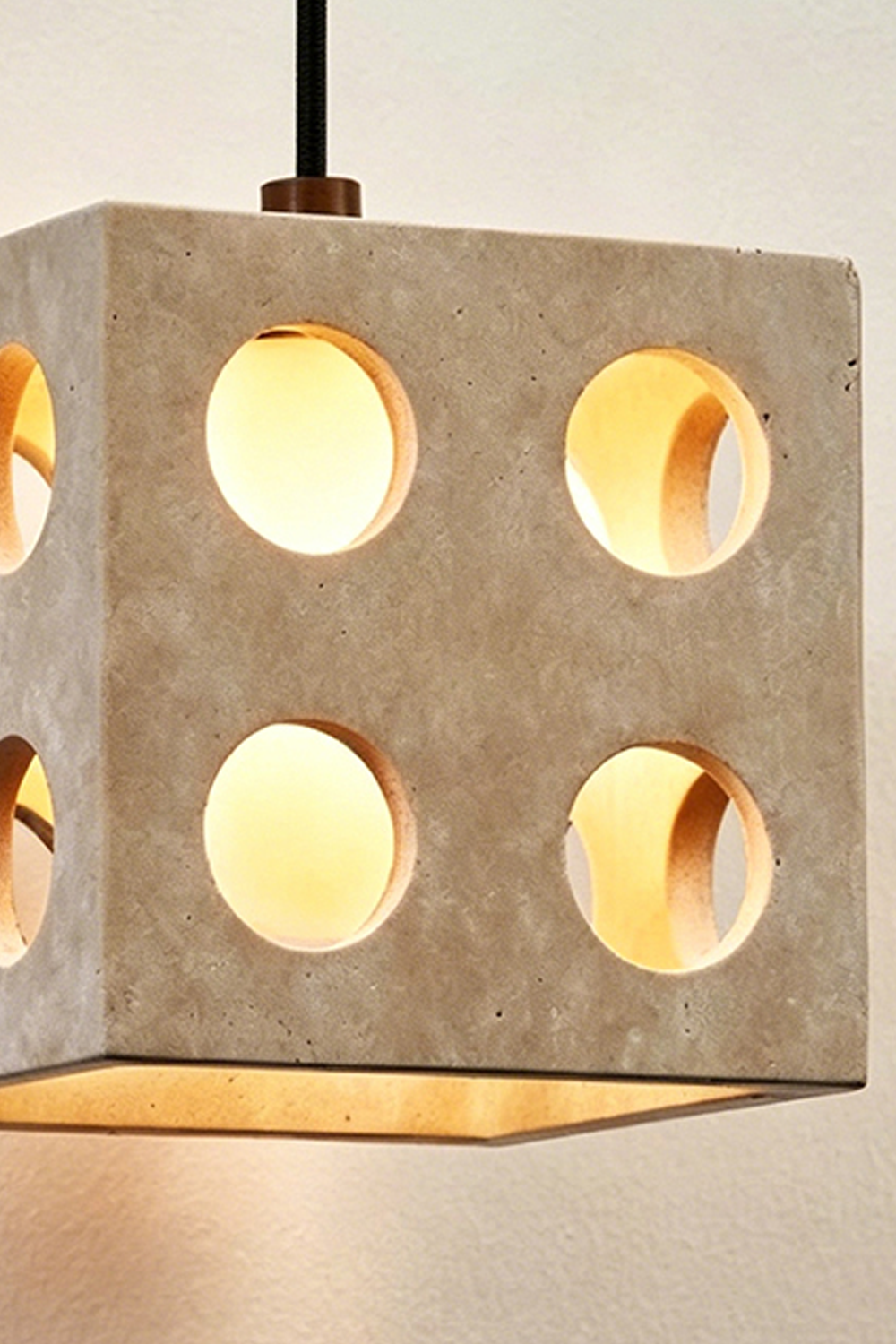 Terra Cube Travertine Pendant Light | Travertine, Metal | Angled lit product view showing depth and light diffusion | Samu Lamp