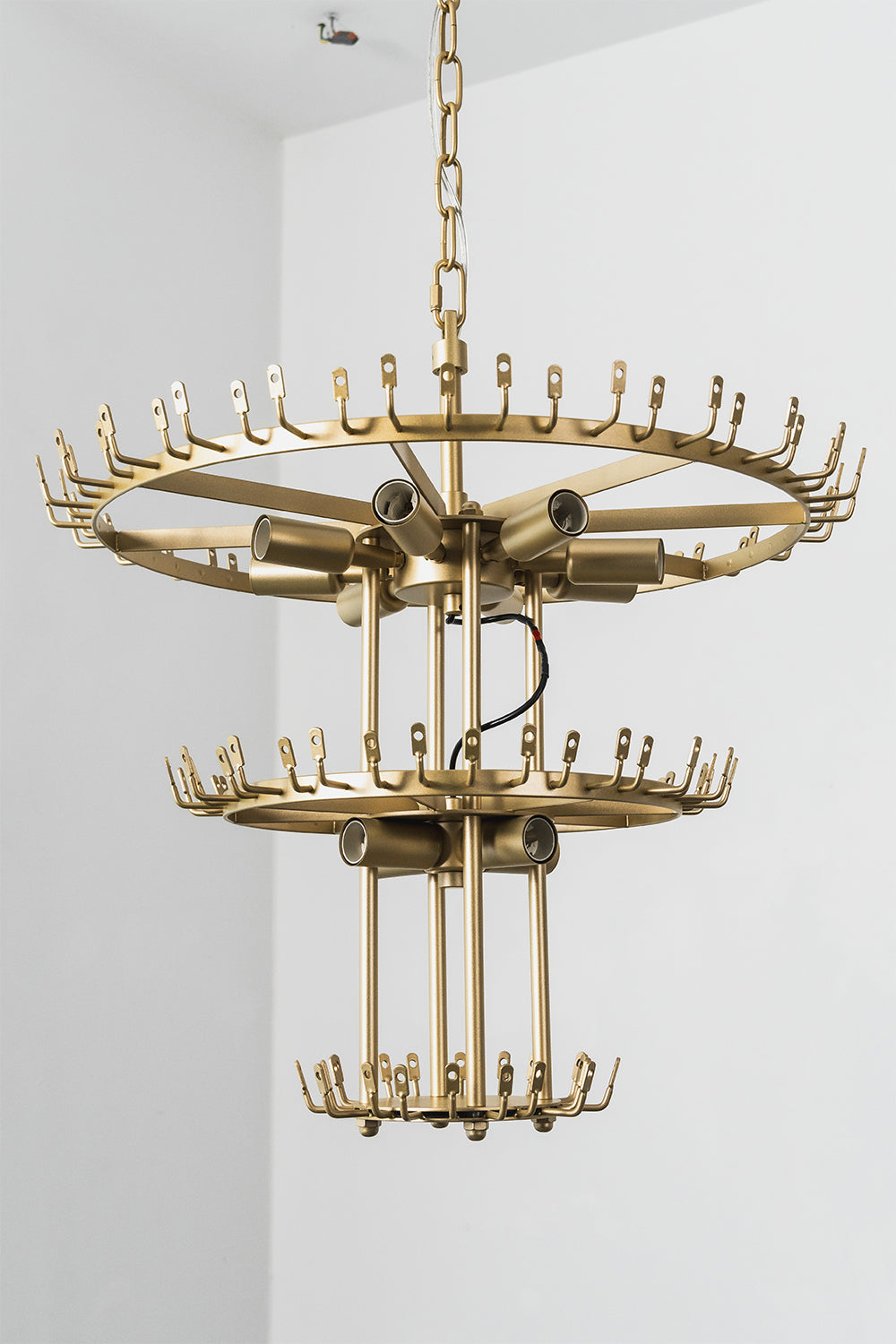 Thalassa Aquamarine Textured Glass Chandelier | Glass, Metal | Clear view of the raw unlit double-tiered gold brass frame skeleton showing empty ring bands with hooks for glass attachment | Detail shot | Samu Lamp