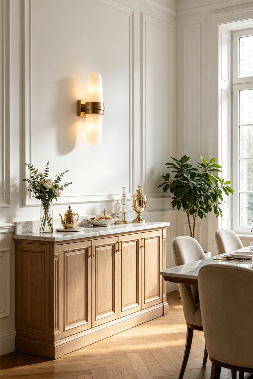 Theron Linear Alabaster Wall Lamp | Alabaster, Metal | Providing a warm ambient downlight and uplight glow above an elegant wooden dining room sideboard credenza | Samu Lamp