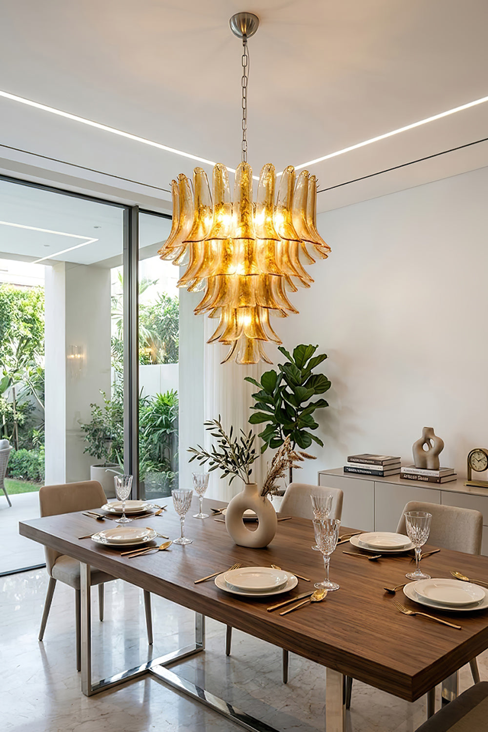 Amber lily petal chandelier over a wooden table | Metal, Glass | Bright modern dining room interior | Samu Lamp