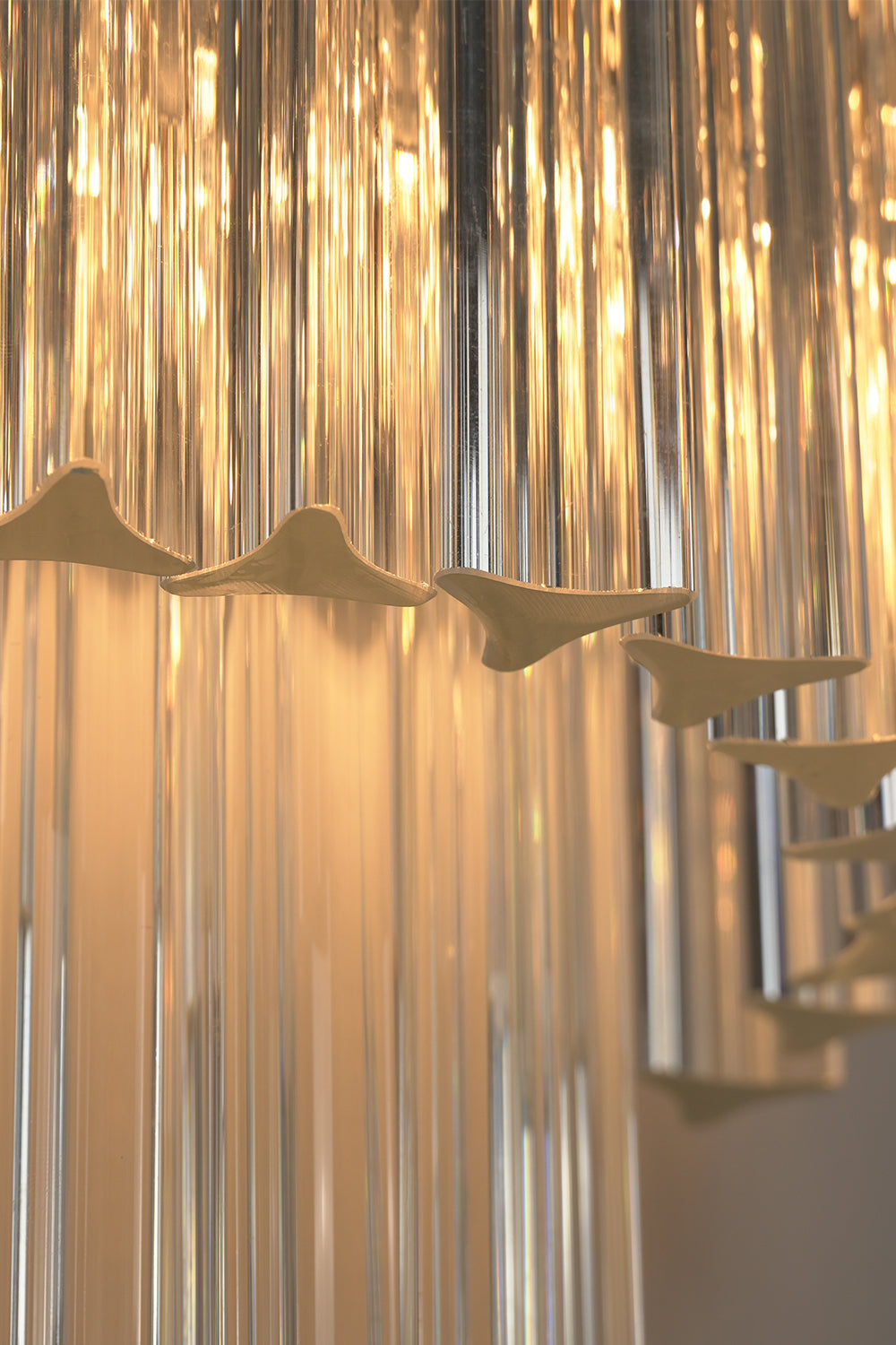Angled close-up of lit glass rods | Metal, Glass | Detail view showing rod texture | Samu Lighting