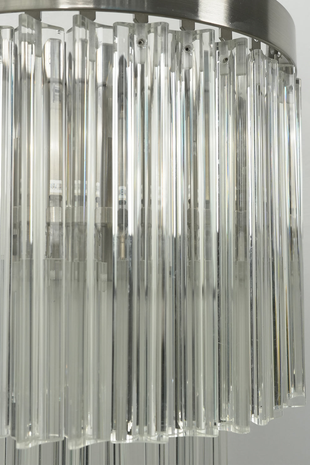 Angled close-up of lit glass rods | Metal, Glass | Detail view showing rod texture | Samu Lighting