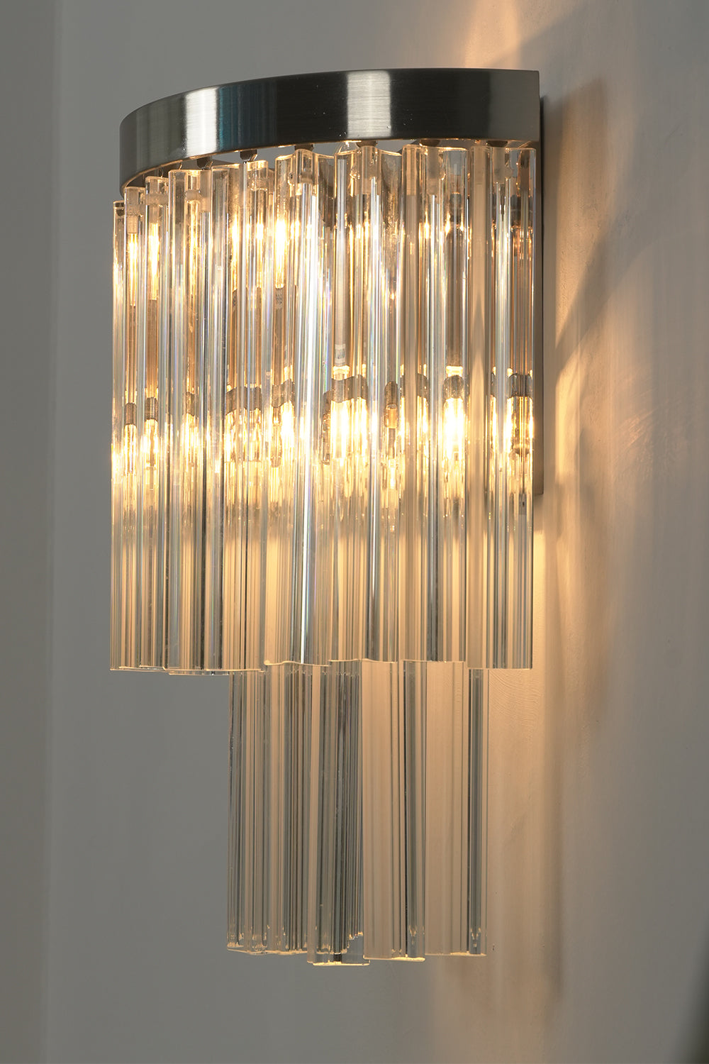 Angled close-up of lit glass rods | Metal, Glass | Detail view showing rod texture | Samu Lighting
