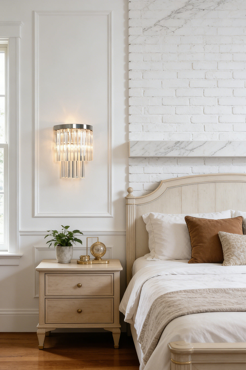 Lit tiered column glass wall light | Metal, Glass | Installed on a classic white wall over a bedside nightstand | Samu Lighting