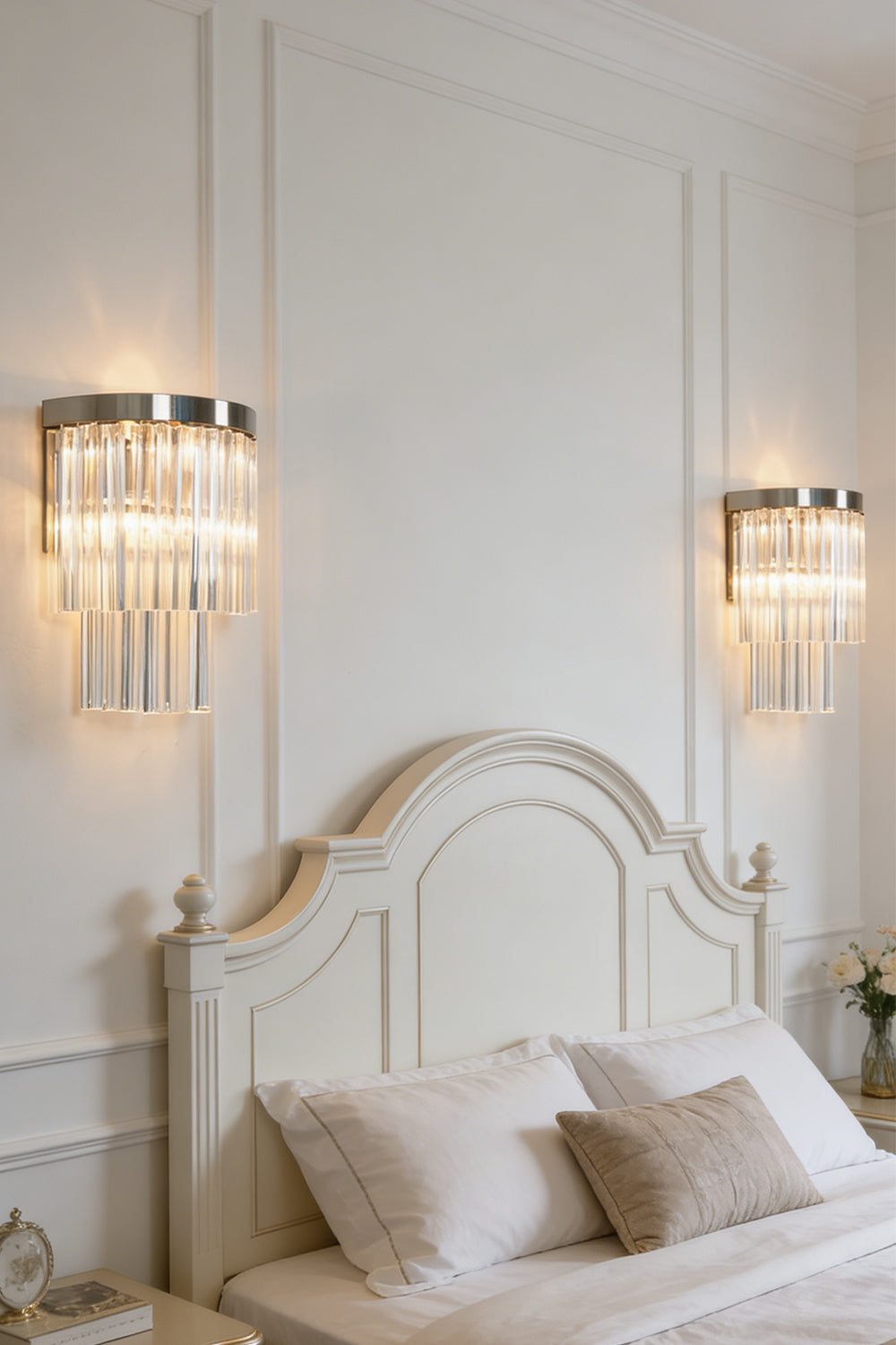 Lit tiered column glass wall light | Metal, Glass | Installed on a classic white wall over a bedside nightstand | Samu Lighting