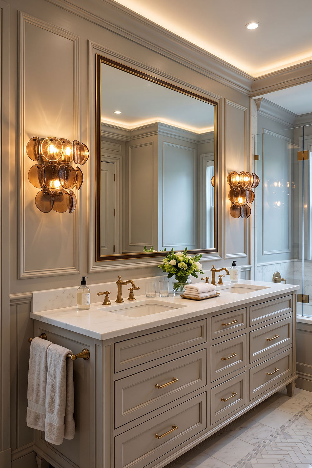 Tisanne Tiered Glass Disc Wall Lamp | Smoked Glass and Metal | Pair of wall sconces flanking a vanity mirror in a bright luxury bathroom | Samu Lamp