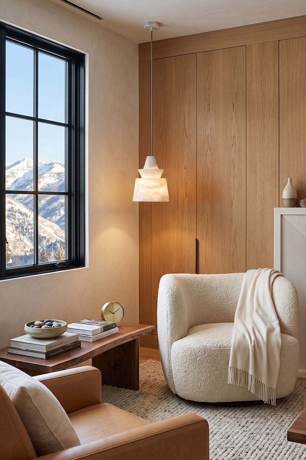 Tobiah Tiered Alabaster Pendant Light | Natural Alabaster and Metal | Suspended in a cozy lounge corner near a white armchair and mountain view window | Samu Lamp