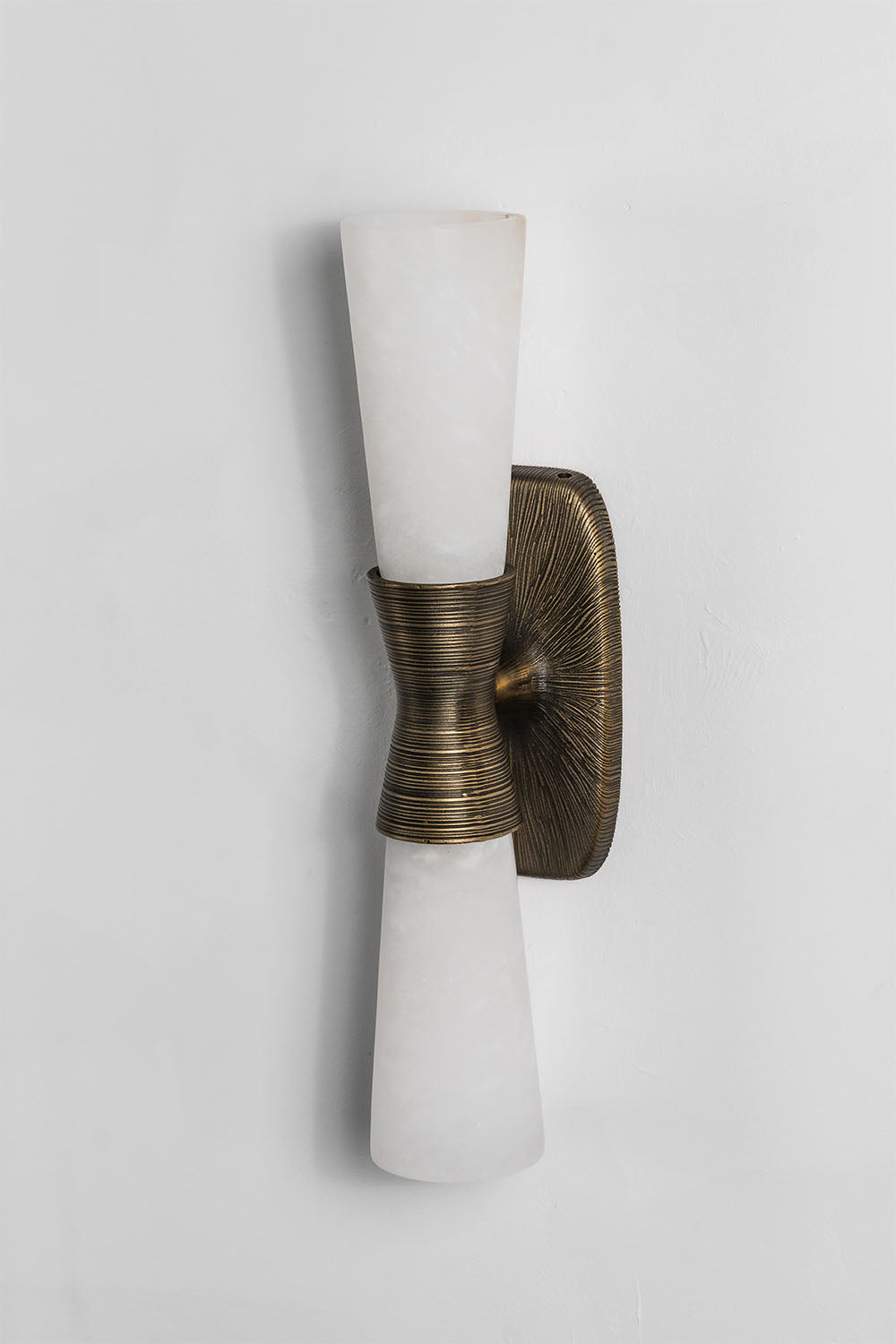 Torsanne Wall Sconce | Alabaster and Bronze | Single-light model unlit angled view on white backdrop | Samu Lamp