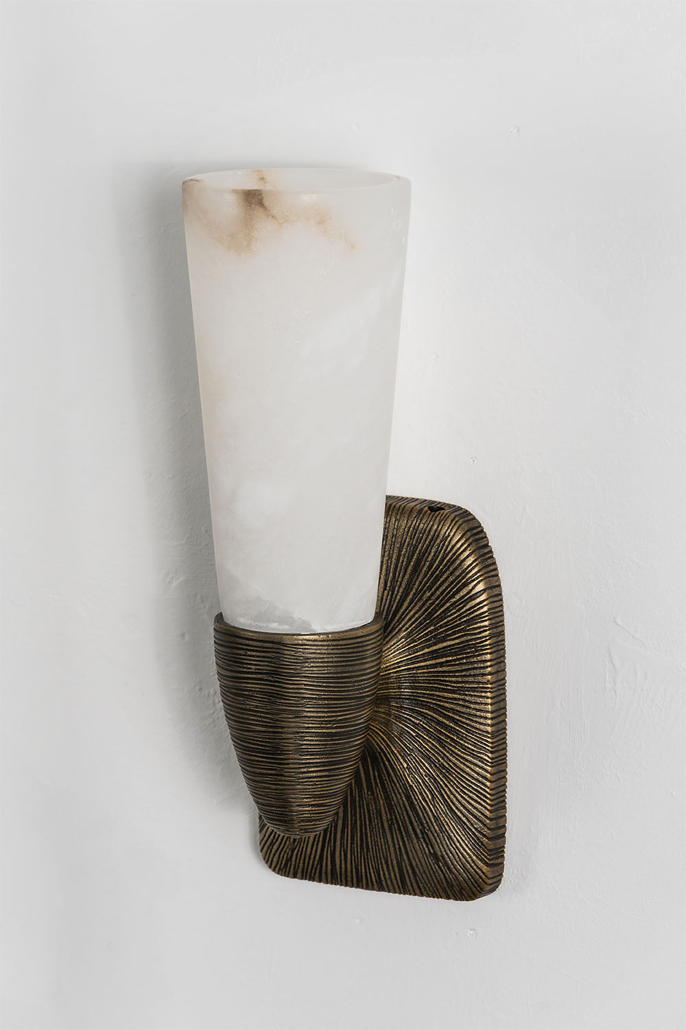 Torsanne Wall Sconce | Alabaster and Bronze | Single-light model unlit angled view on white backdrop | Samu Lamp