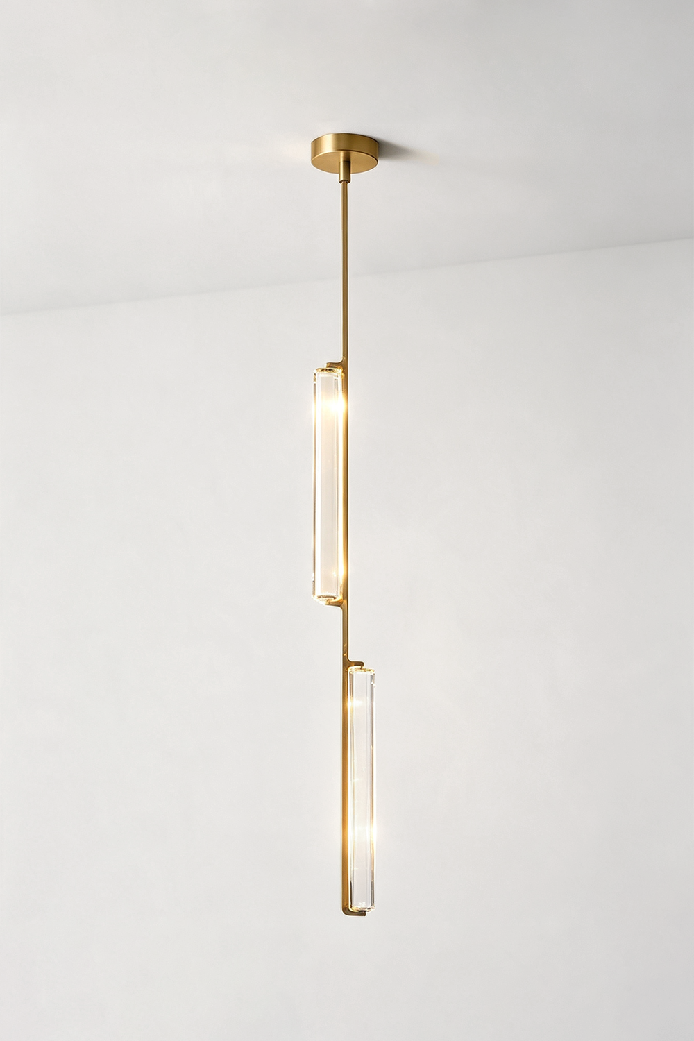 Torvald Crystal Bar Drop Pendant Light showcasing a modern design with sleek gold accents and elegant crystal detail.