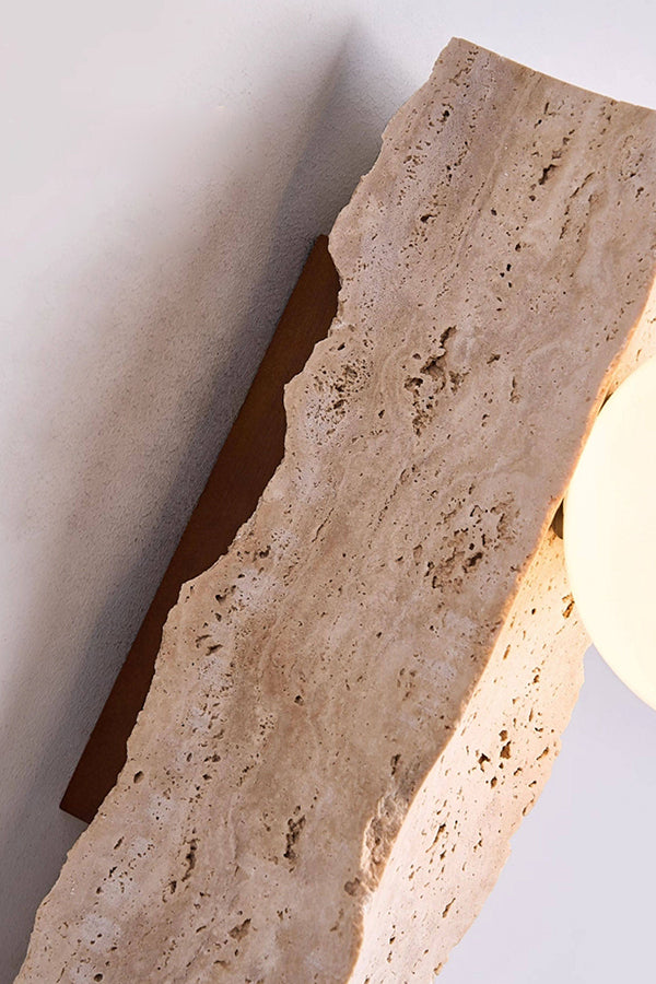 Close-up of raw travertine texture and glass globe | Yellow Travertine | Macro shot showing the rough stone edge and warm light | Samu Lamp