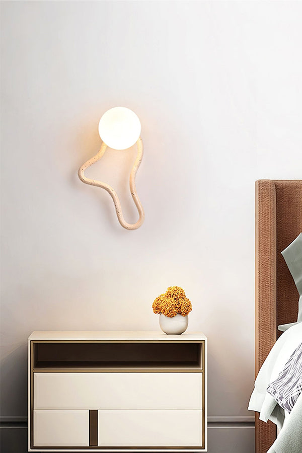 Sculptural travertine wall light in a serene bedroom | Travertine, Glass, Wood | Bedside installation with minimalist furniture | Samu Lamp