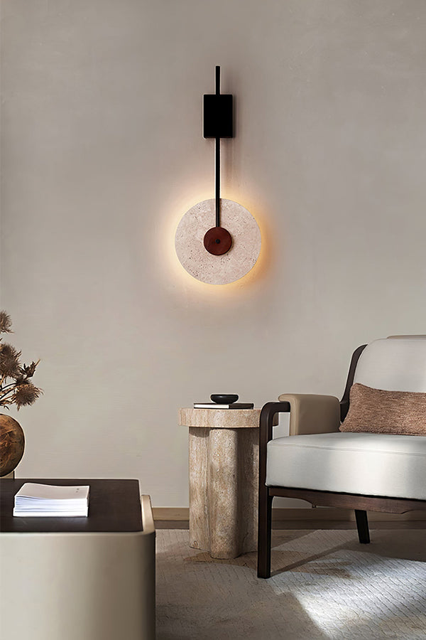 Sculptural travertine wall light in a neutral living room | Travertine, Wood, Metal | Interior scene with a modern side table and chair | Samu Lamp