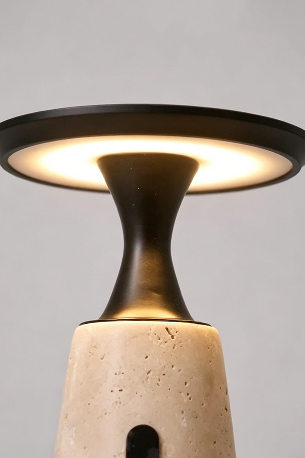 Travertine Obelisk Table Lamp detail | Metal, Travertine | Close-up of light diffusion under the disc | Samu Lamp