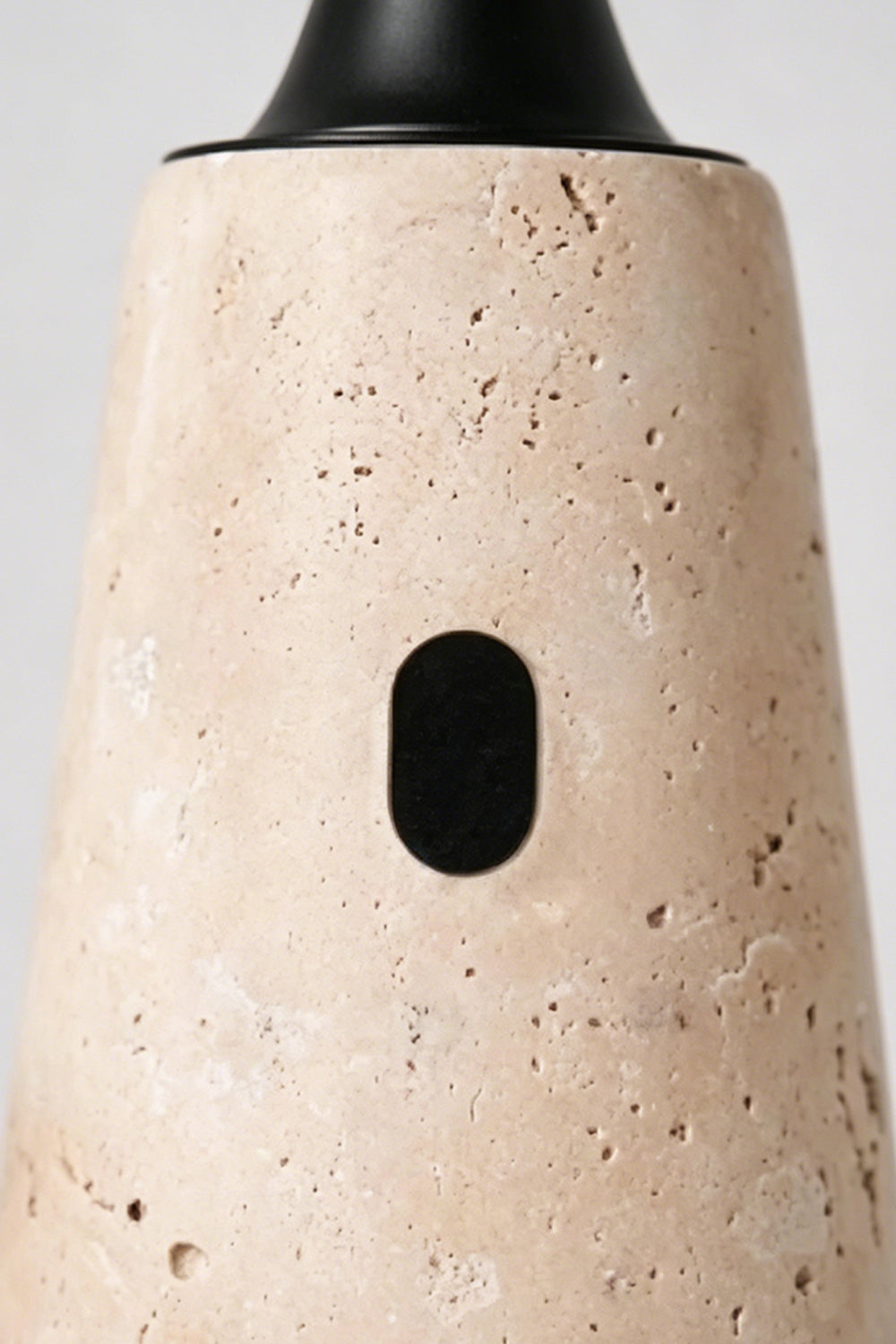 Travertine Obelisk Table Lamp detail | Travertine | Macro shot of porous stone and power sensor | Samu Lamp