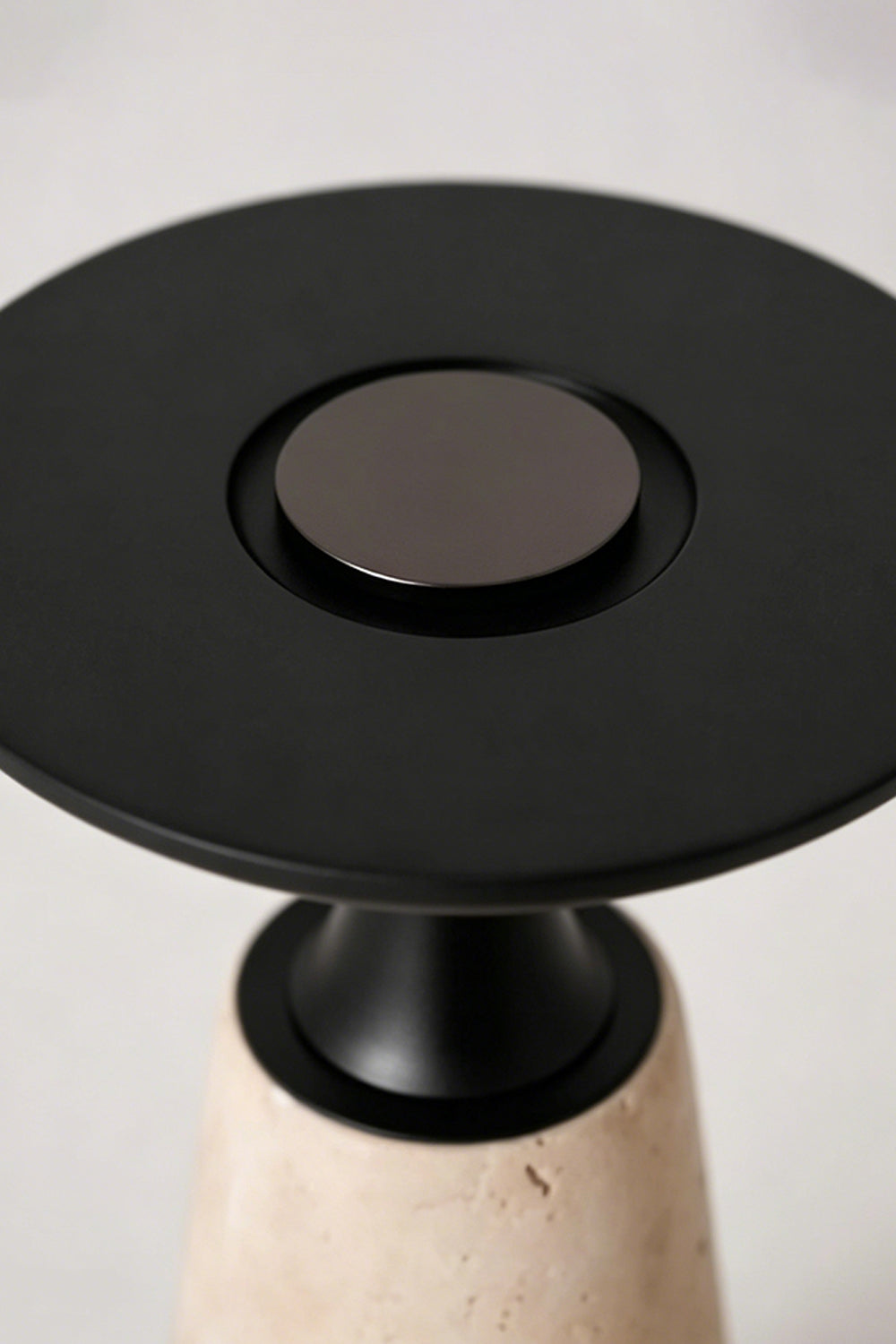 Travertine Obelisk Table Lamp detail | Metal | Top-down view of black metal finish and button | Samu Lamp
