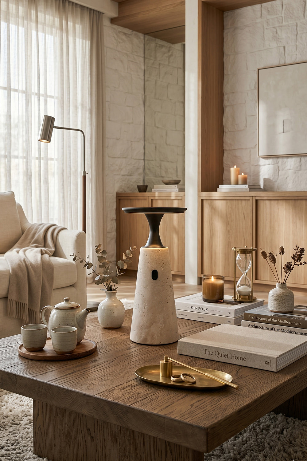 Travertine Obelisk Table Lamp | Metal, Travertine | Placed on wooden coffee table in contemporary lounge | Samu Lamp
