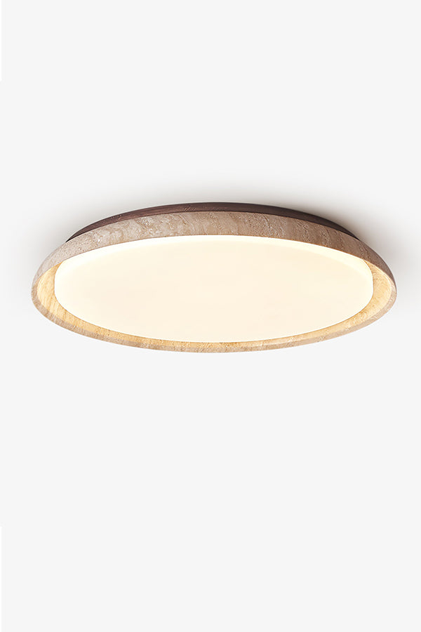 Front view of lit round travertine flush mount light | Wood, Travertine, Acrylic | Focused on the warm even diffusion and stone texture | Samu Lamp