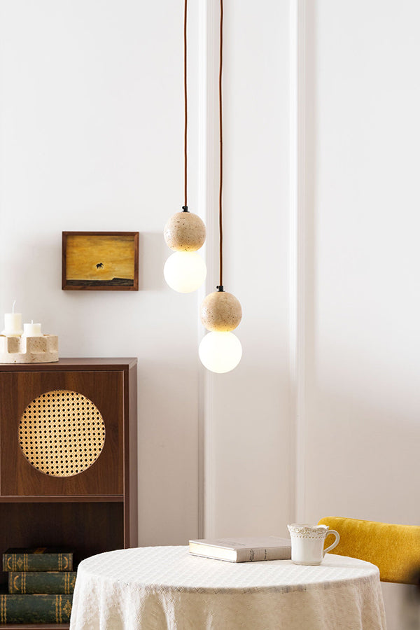 2-light cluster travertine pendant over a cafe table | Yellow Travertine, Glass | Warm lighting in a modern organic interior | Samu Lamp