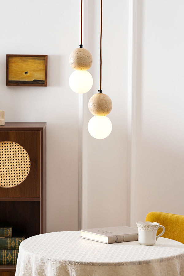 2-light cluster travertine pendant lamp | Yellow Travertine, Glass | Hanging over a small round table with a yellow chair | Samu Lamp