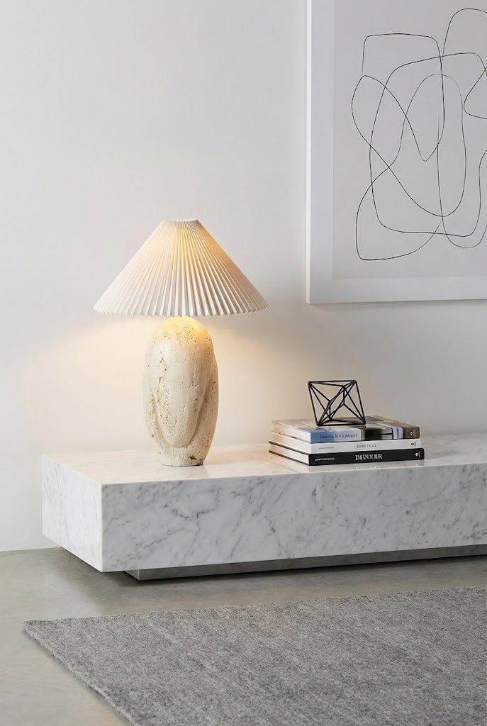 Travertine stone lamp in a modern living room | Travertine, Fabric | On a marble console near minimalist wall art | Samu Lamp