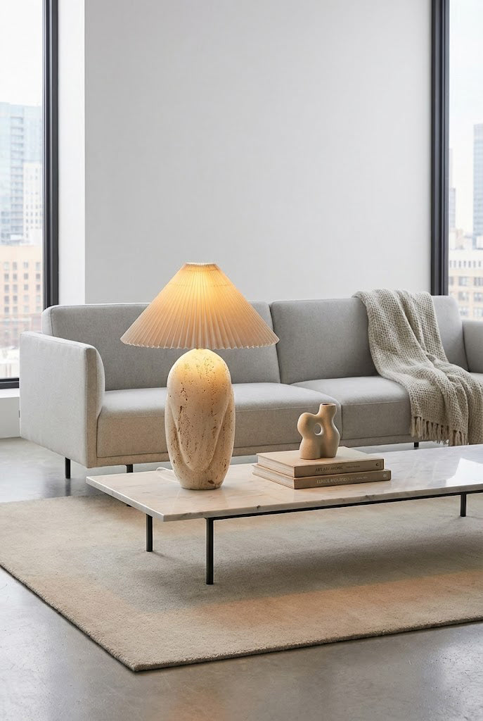 Statement stone table lamp | Travertine, Fabric | Centered on a large coffee table in a modern lounge | Samu Lamp