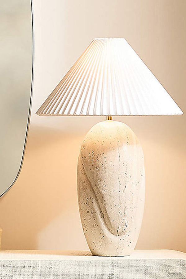 Detailed view of travertine table lamp | Travertine, Fabric | Close-up showing warm light and stone grain | Samu Lamp