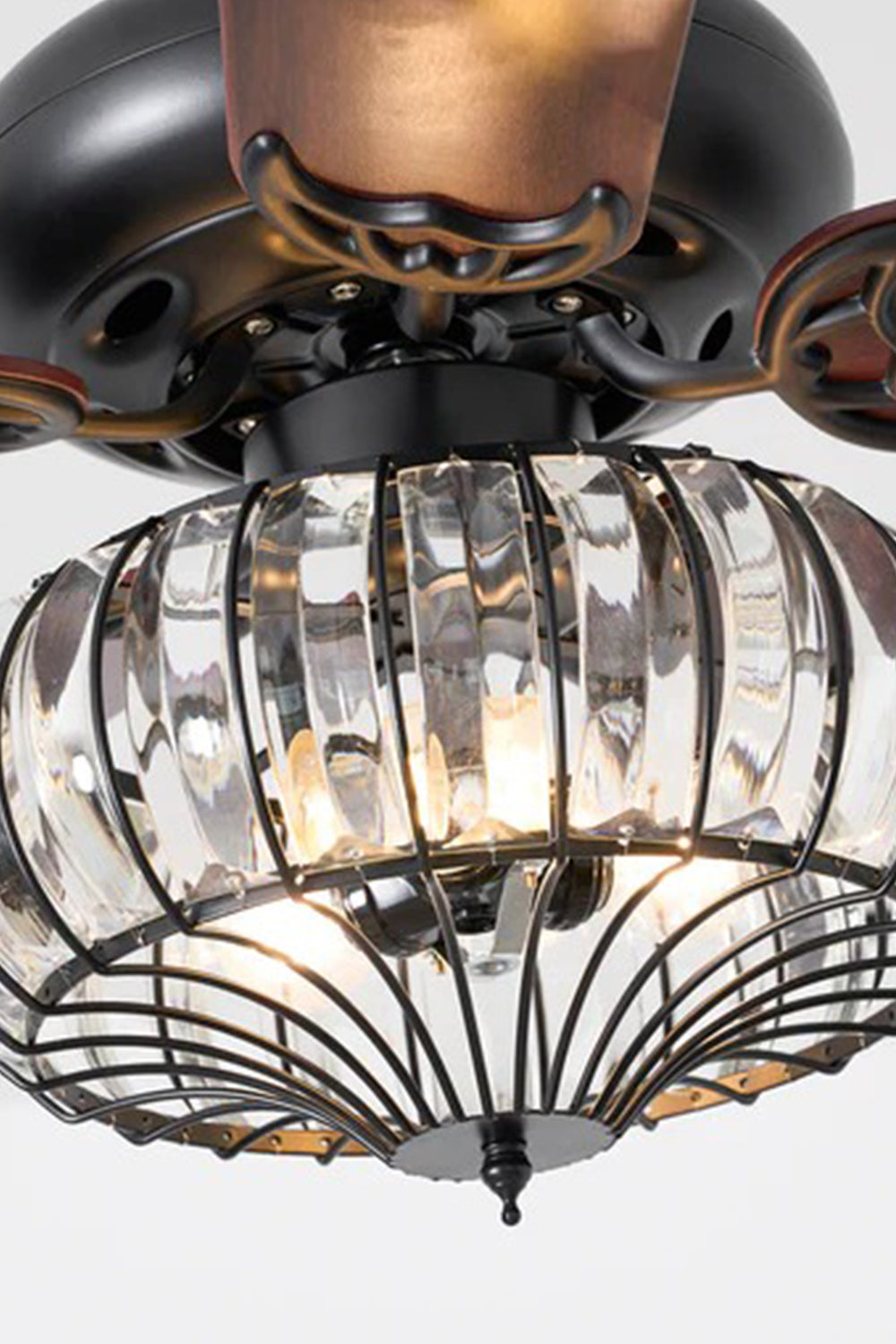 Valerius Luxury Crystal Ceiling Fan Light | Crystal, Metal, Wood | Side close-up view of the fully illuminated crystal drum basket shade radiating a brilliant glowing shimmer from within | Detail shot | Samu Lamp