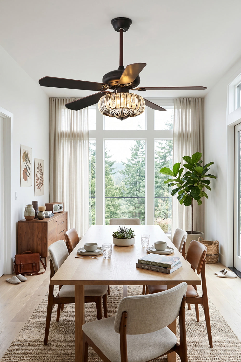Valerius Luxury Crystal Ceiling Fan Light | Crystal, Metal, Wood | Hanging centered above a long wooden dining table set in a modern high-ceiling dining room near tall windows | Samu Lamp