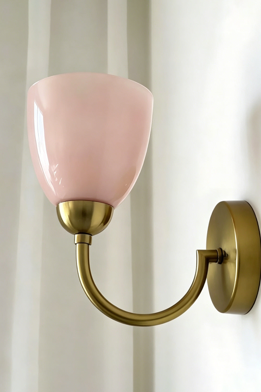 Veil Curve Glass Wall Lamp with pink shade | Metal, Glass | Detail shot of pink shade profile against light wall | Samu Lamp