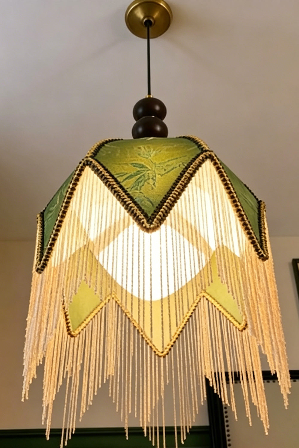 Verdure Cascade Pendant Light detail | Wood, Metal, Fabric | Angle perspective looking up at cascading fringes | Product detail | Samu Lamp