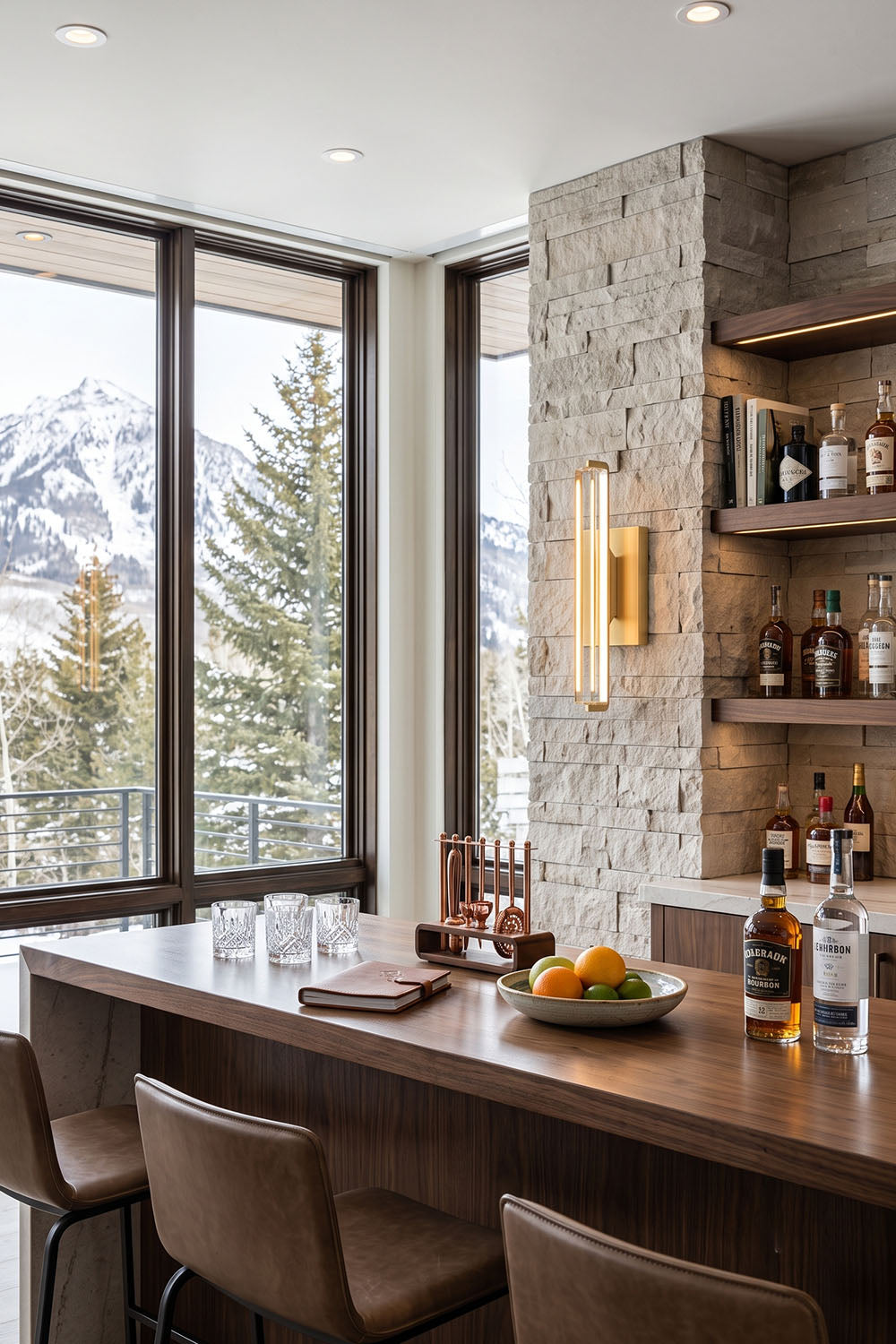 Verel Crystal Bar Wall Sconce illuminating a stylish bar area with mountain views.