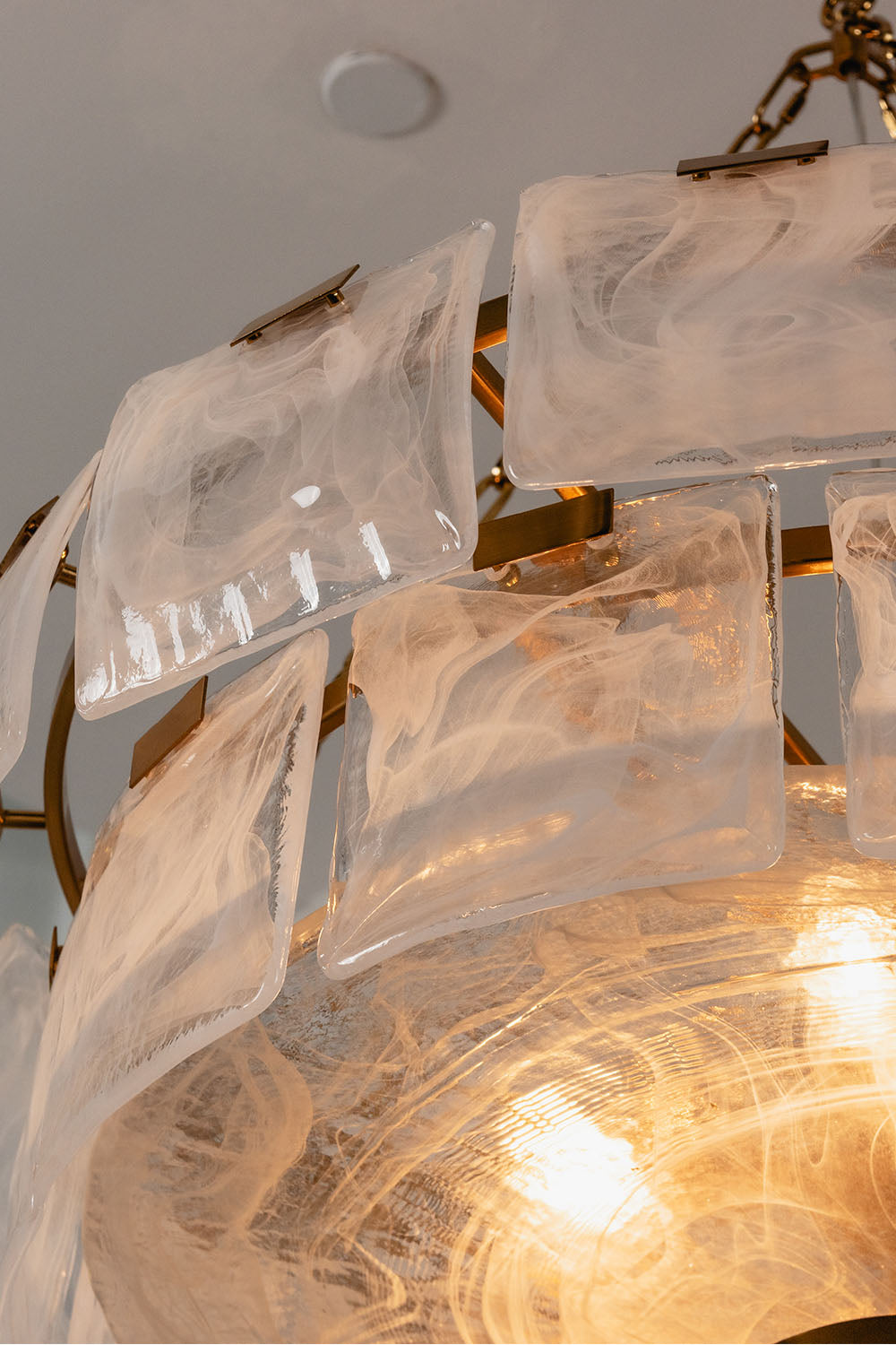 Verel Stepped Glass Drum Chandelier showcasing unique glass and brass design elements.