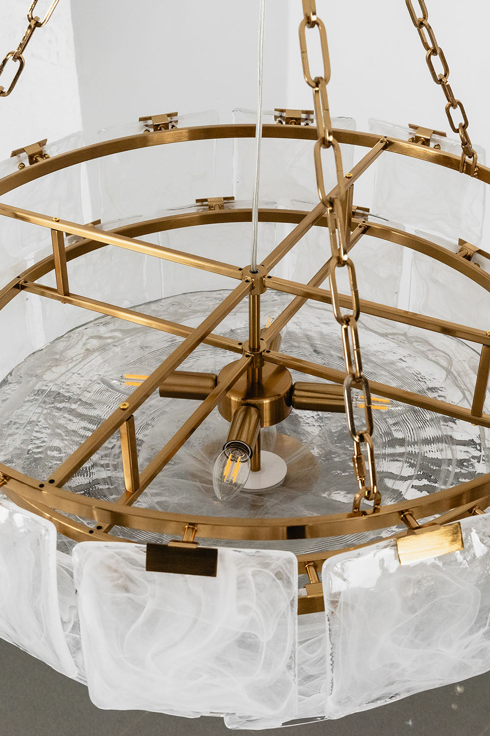 Verel Stepped Glass Drum Chandelier showcasing intricate design and elegant brass accents.