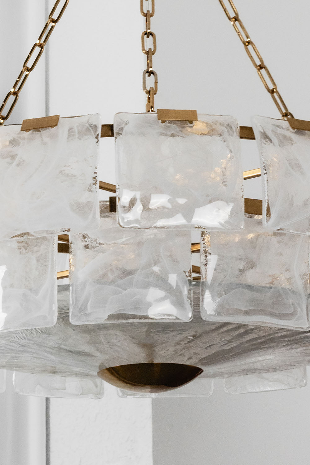 Verel Stepped Glass Drum Chandelier featuring a unique design with frosted glass and elegant gold accents.