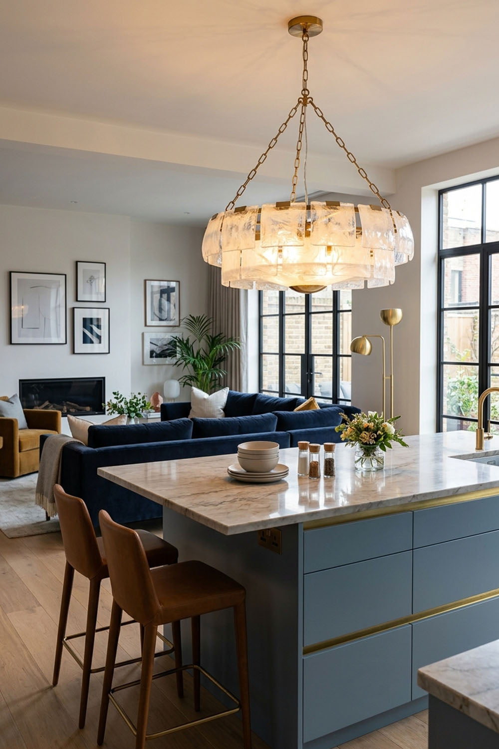 Verel Stepped Glass Drum Chandelier hanging over a modern kitchen island in a stylish home interior.