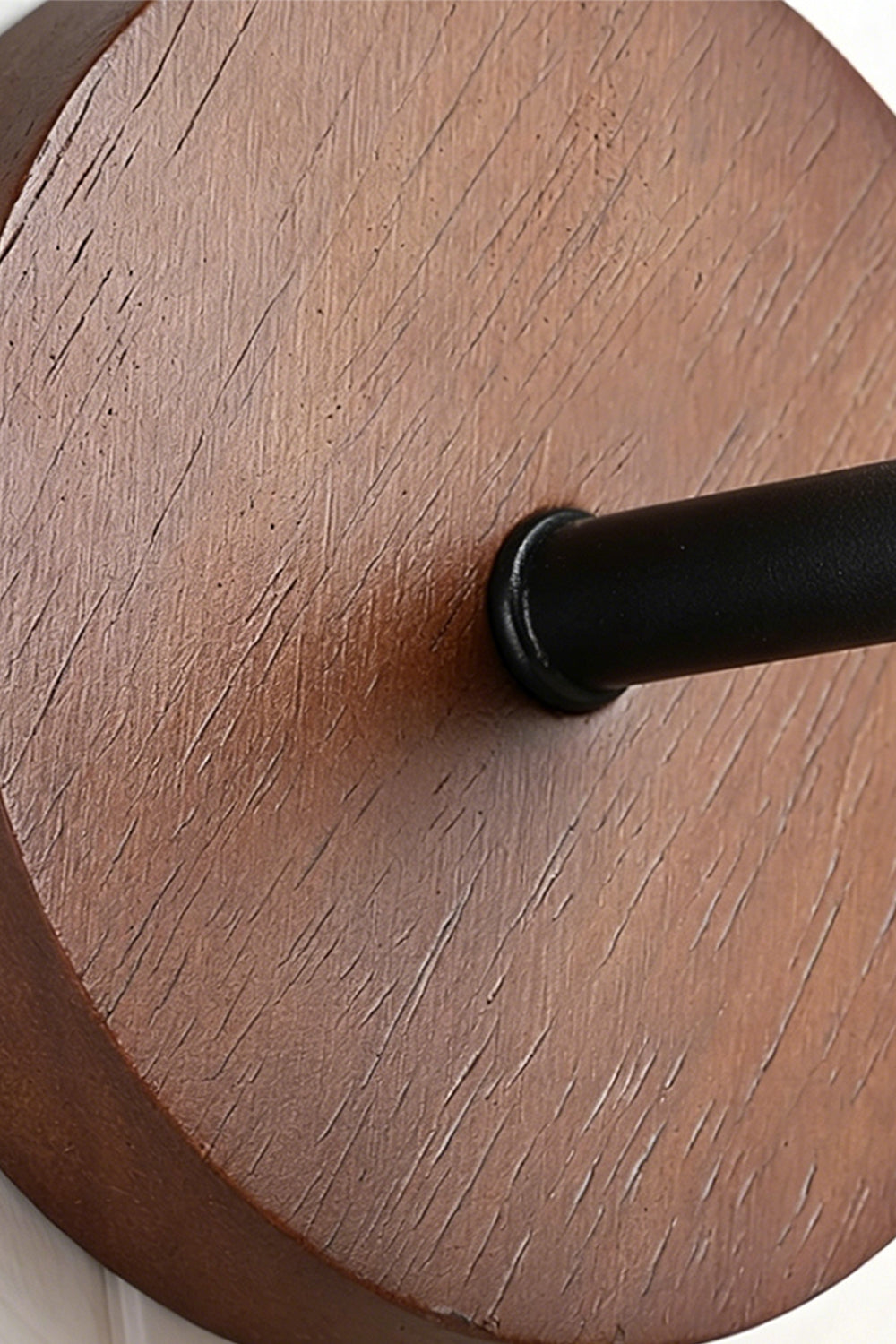 Vesper Cone Travertine Wall Light | Wood | Close-up of circular wood mounting plate and arm | Samu Lamp